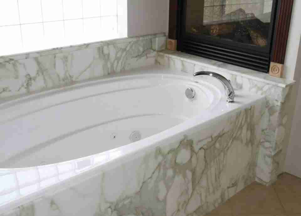 bathtub installation with fireplace